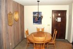Mammoth Lakes Vacaiton Rental Chamonix A7 - Front Door and Cozy Dining Area with Seating for Four